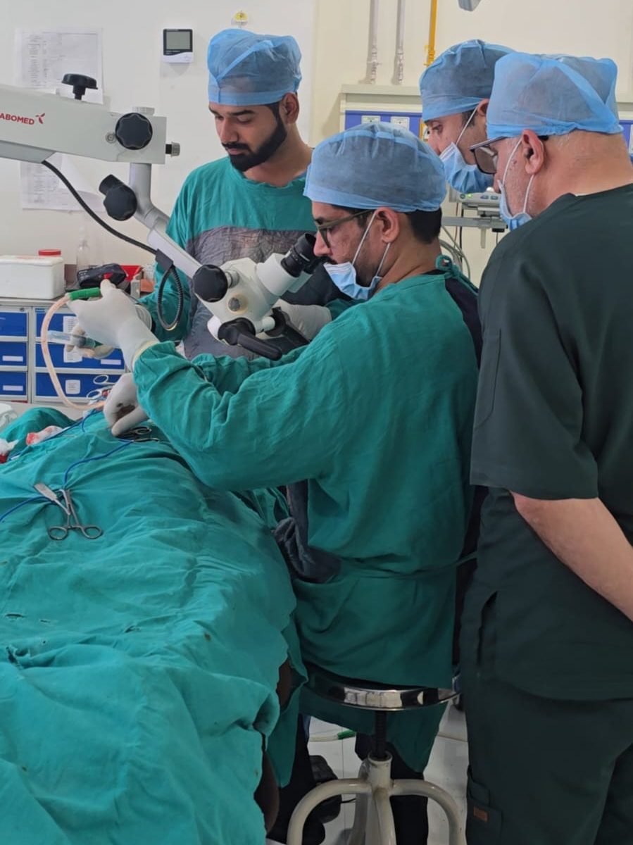 Clinical team during microscope-assisted surgery